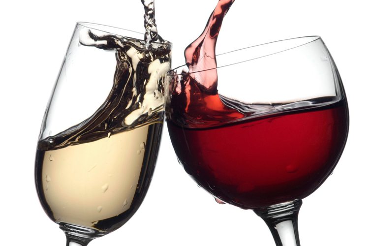 Red and white wine classes clashing together for a cheers